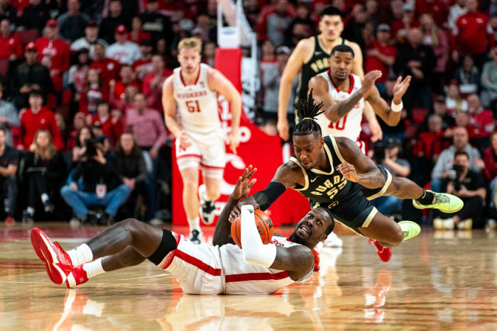 Nebraska forward Juwan Gary and Purdue guard Lance Jones fight for a loose ball during the first half Tuesday night at Pinnacle Bank Arena in Lincoln. (Jan 9, 2024)